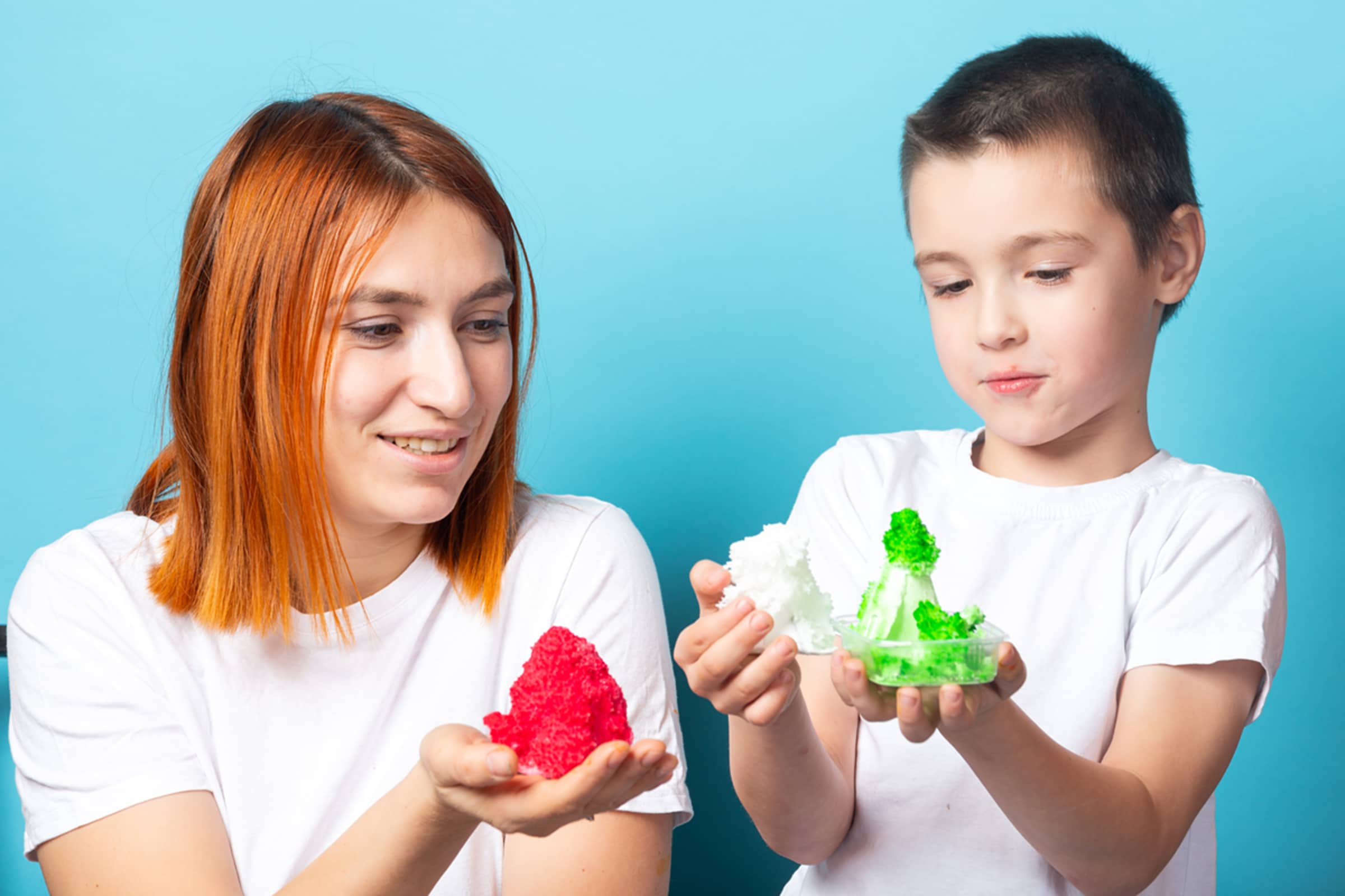 Mother and son showing the crystals they grew.