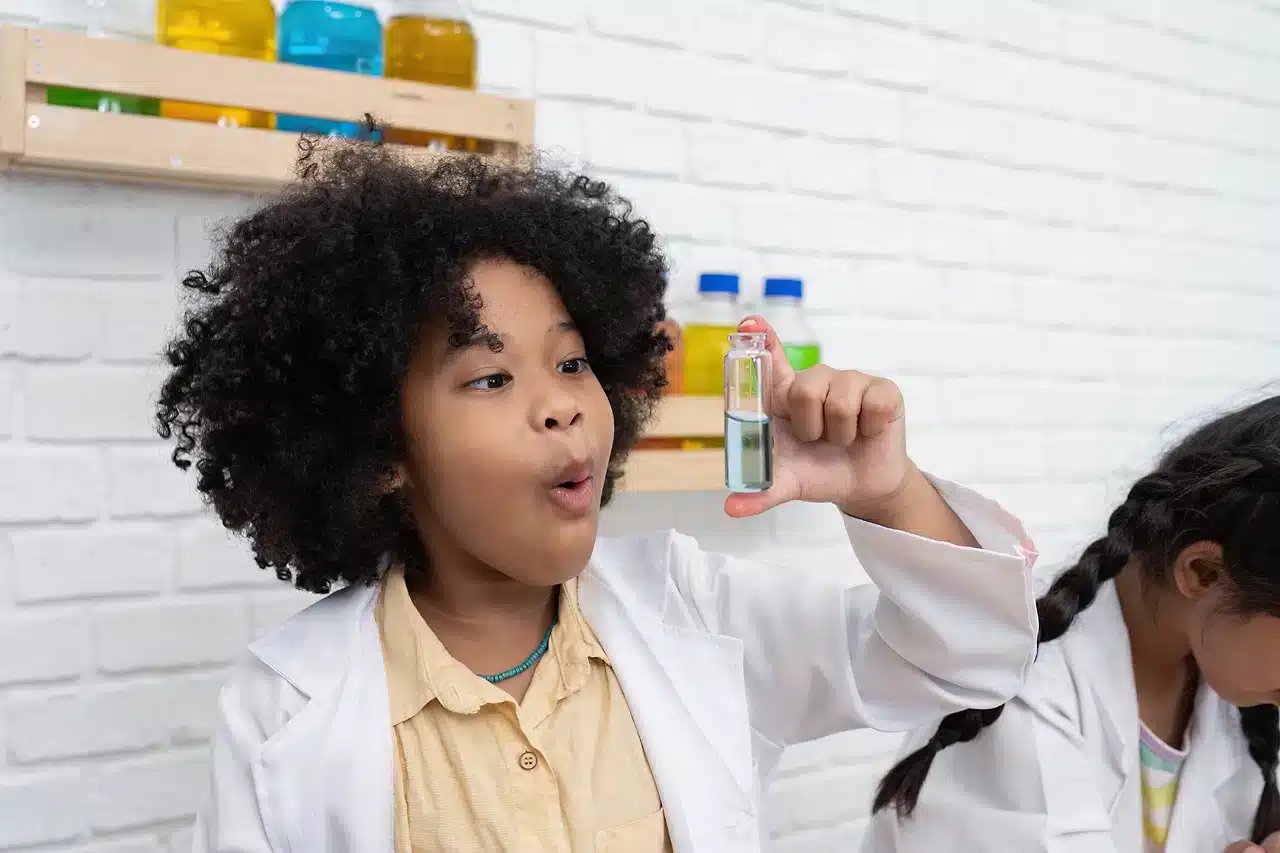 Young girl loving a chemistry lab. 